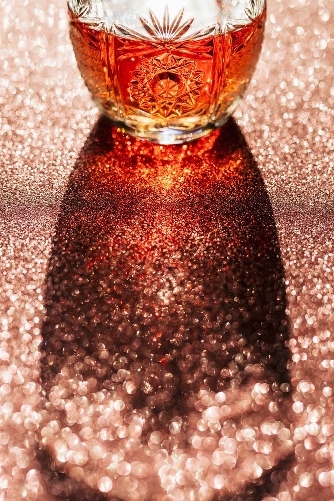 Whisky in a glass on a copper background
