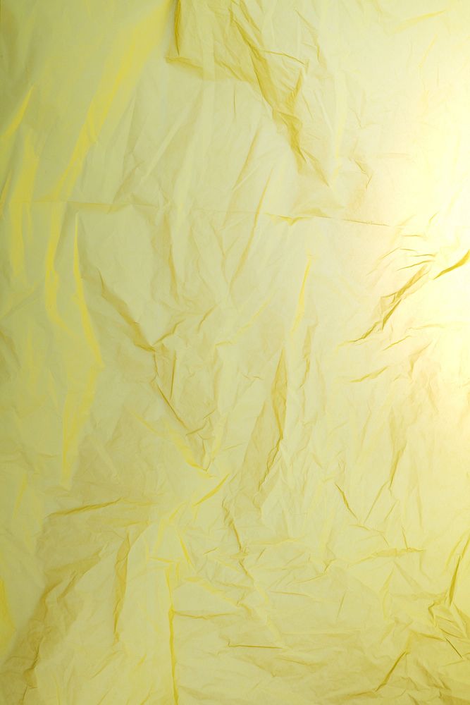Crumpled yellow paper with copy space