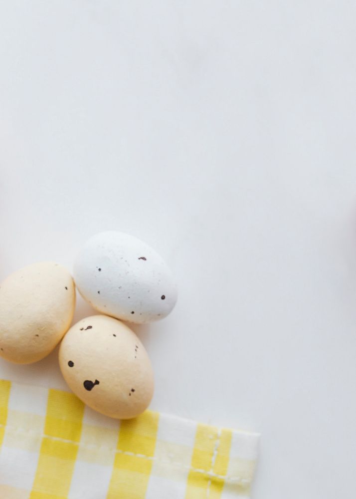 Chocolate Easter eggs on a yellow cloth flatlay