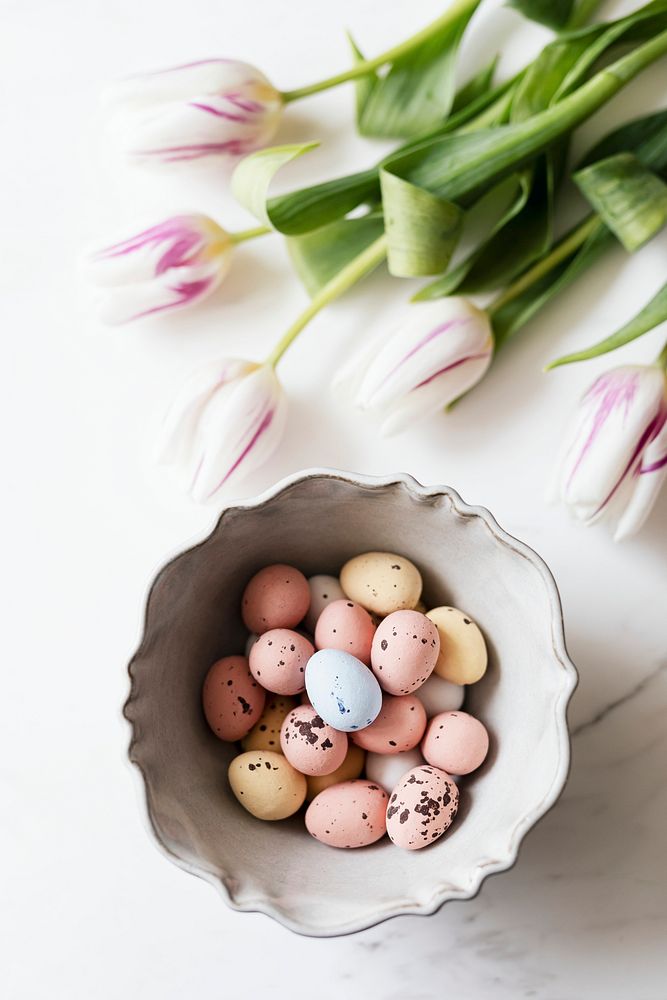 Chocolate Easter eggs and tulips spring flatlay
