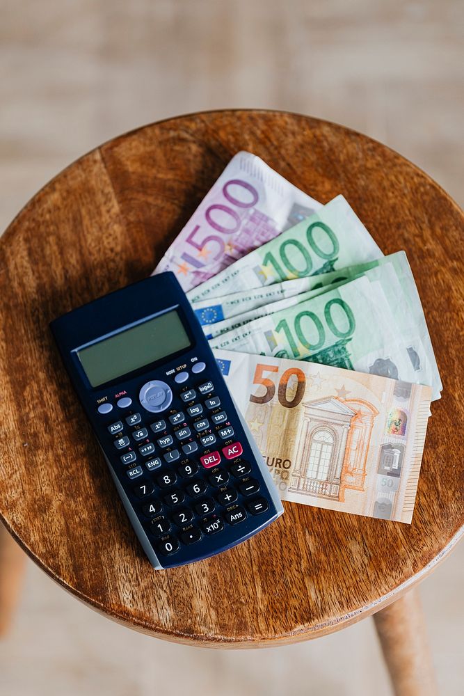 Calculator and Euro banknotes on a table