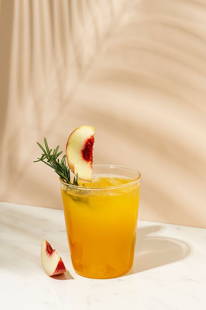 Peach and rosemary cocktail drink