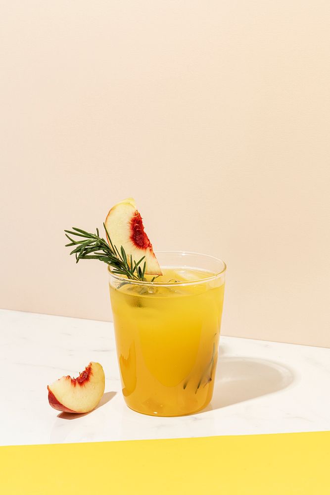 Peach and rosemary cocktail drink