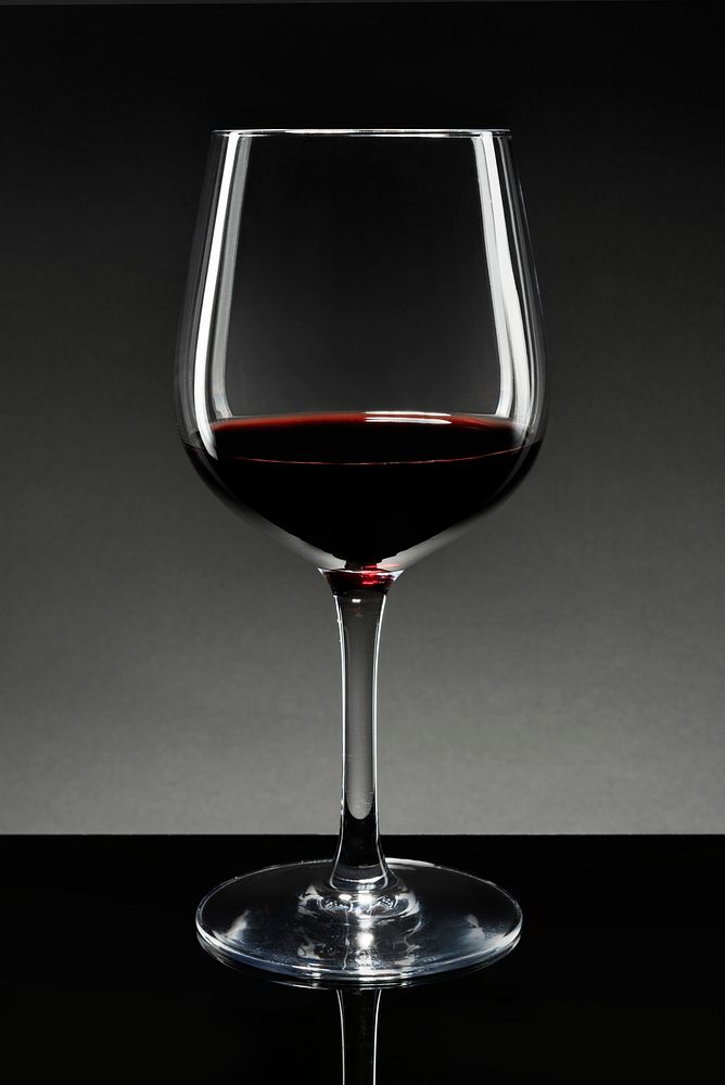 Wine glass filled with red wine 
