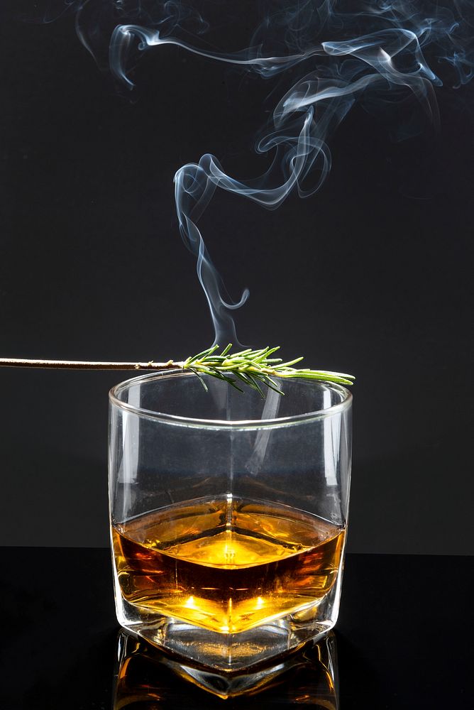 Smoked rosemary on whisky glass