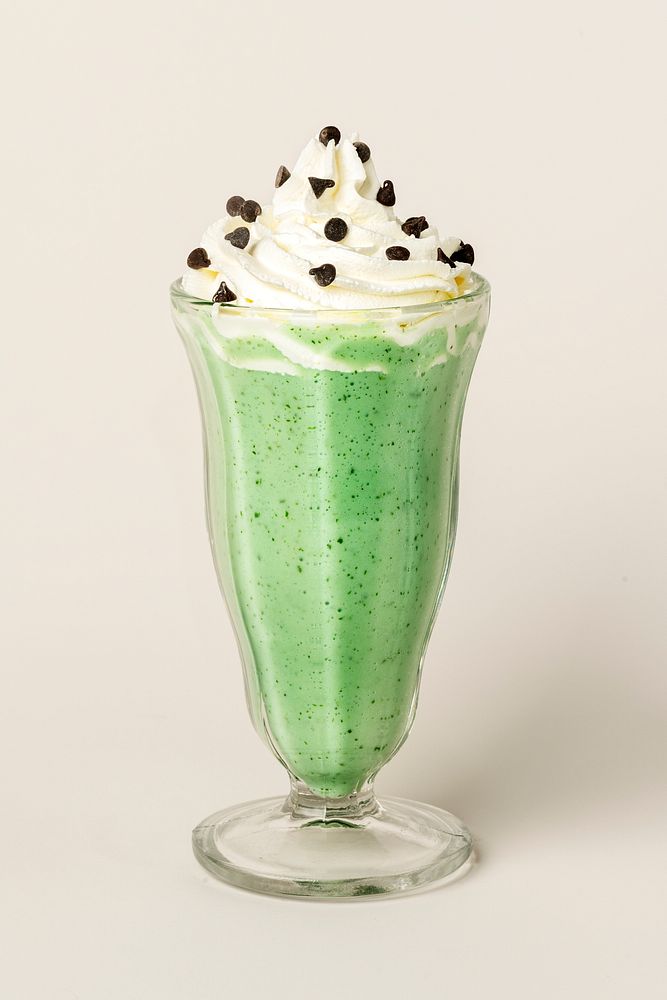Matcha smoothie topped with whipped cream