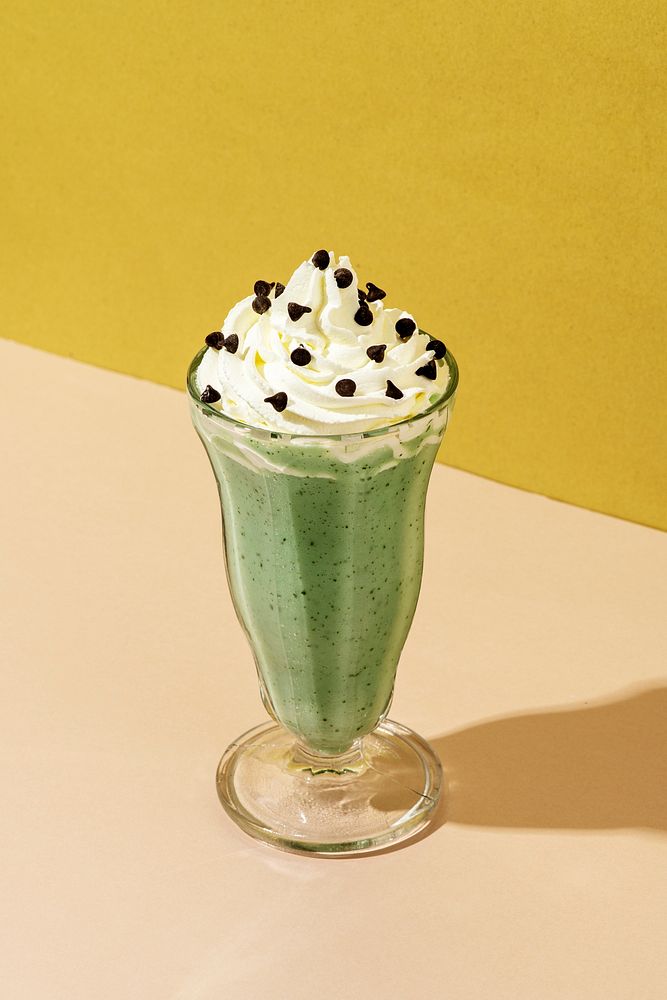Matcha smoothie topped with whipped cream