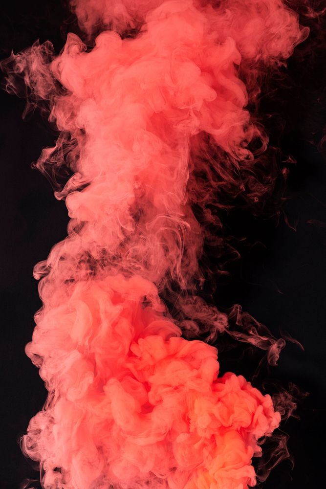 Coral red smoke effect on a black background