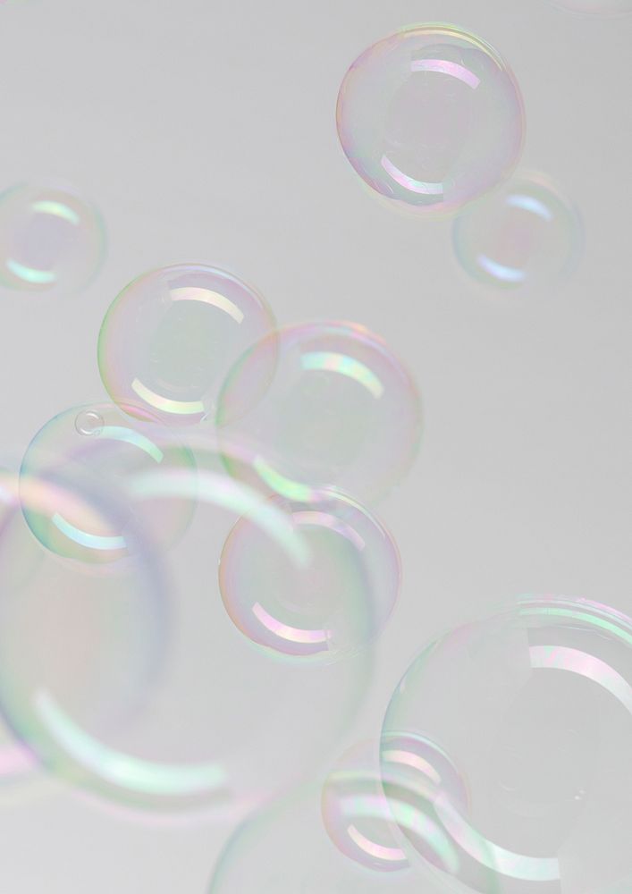 Transparent soap bubble pattern on a gray background