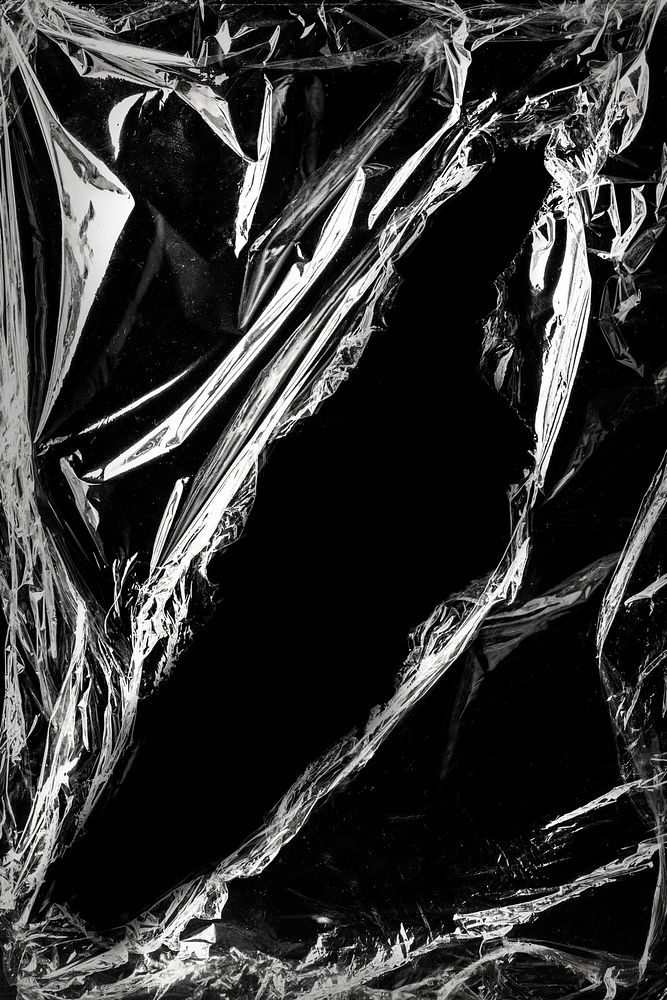 Wrinkled plastic wrap texture design element on a black background