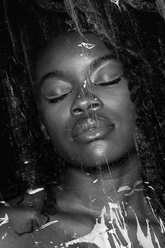 Beautiful black woman behind a plastic wrap