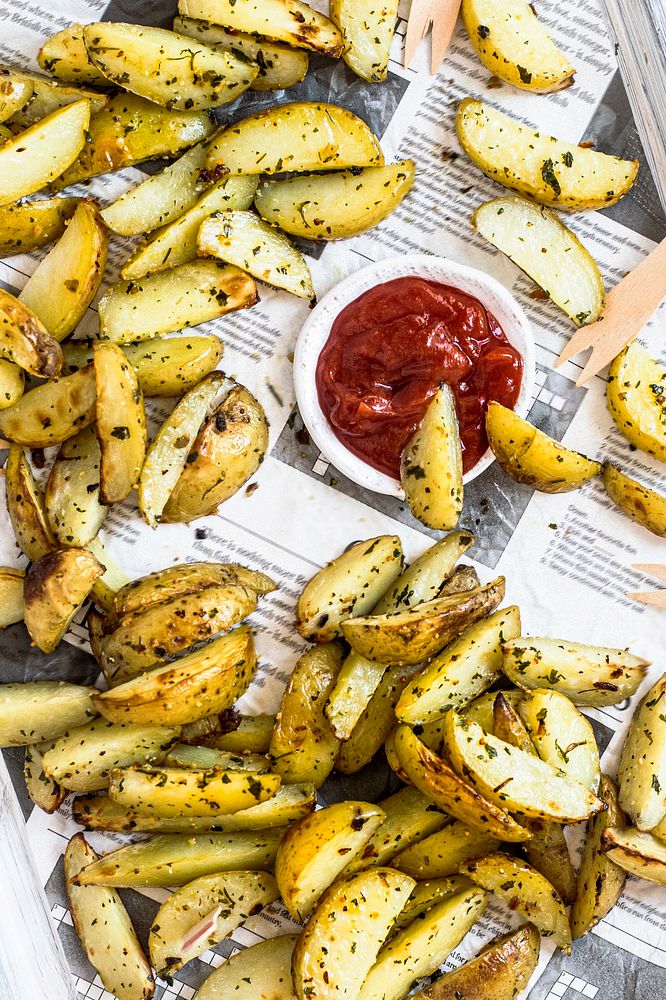 Potato wedges with ketchup on a tray