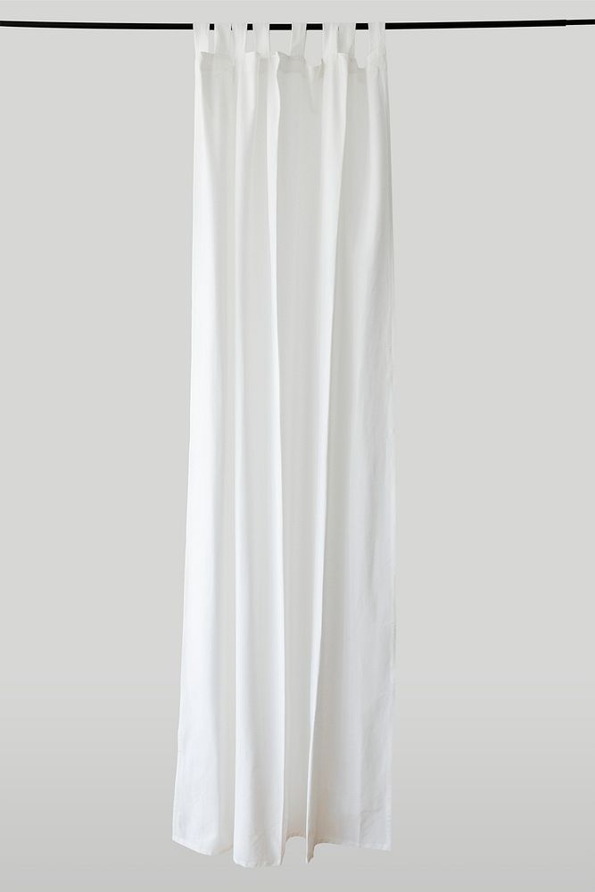 White drapery hanging from a curtain rod