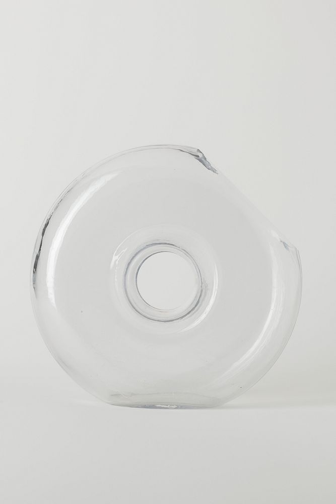 Crystal glass circle vase on off white background