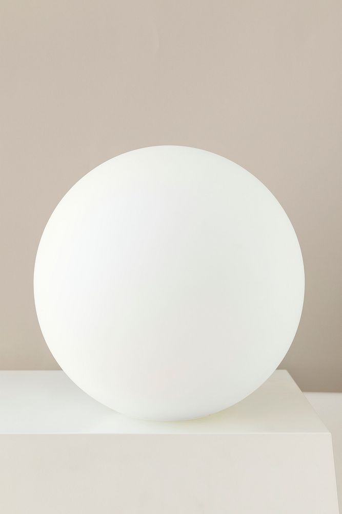 Minimal white decorative ball on a table