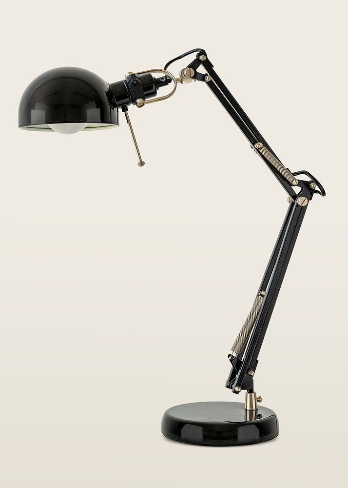 Vintage black desk lamp on off white background