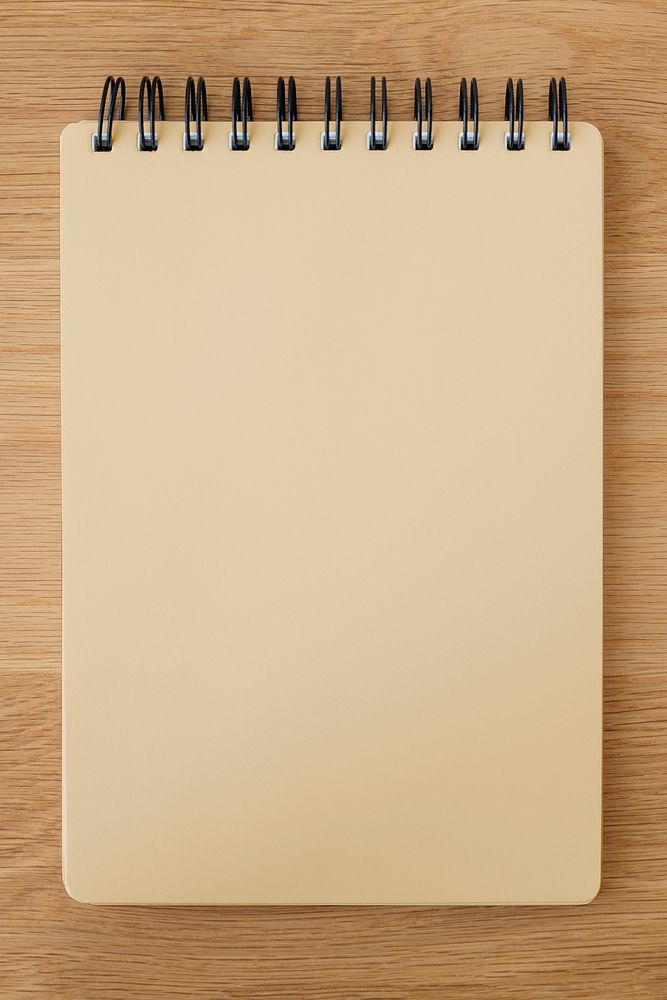 Brown ruled notebook mockup on a wooden table
