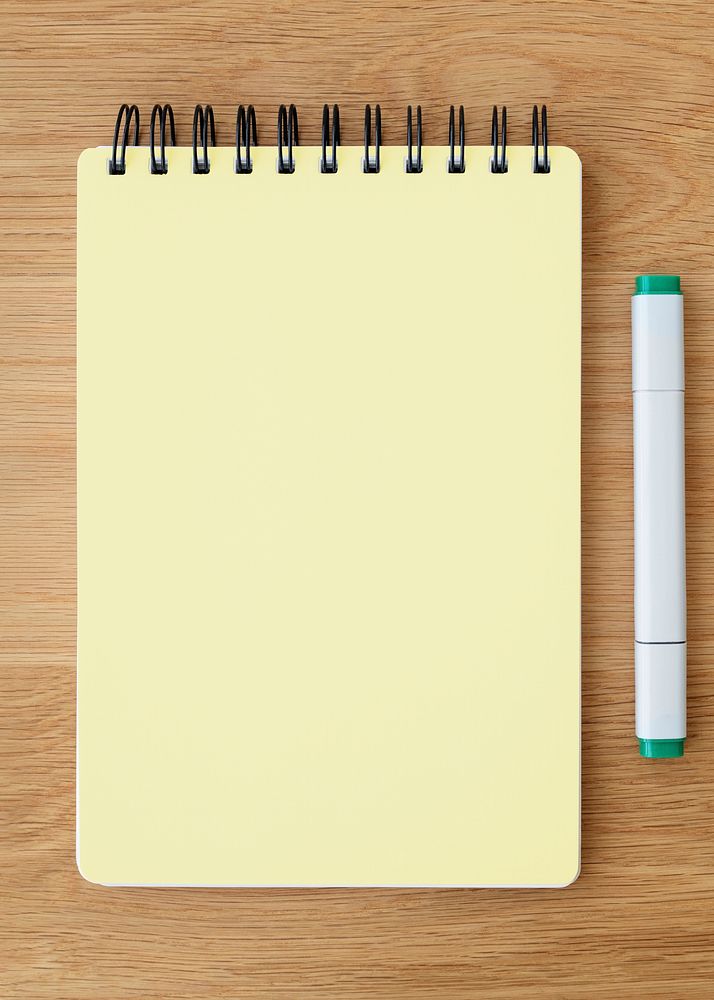 Blank plain yellow notebook page with a pen mockup