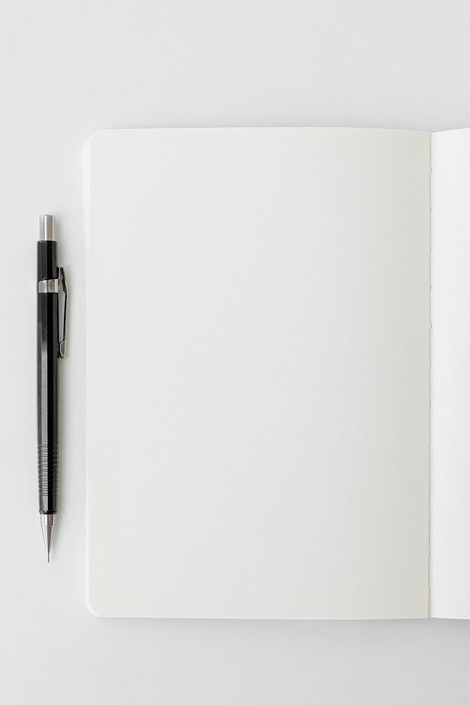 Blank plain white notebook page with a pencil