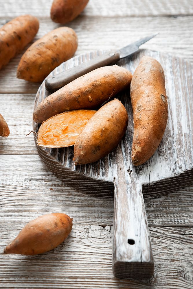 Sweet potatoes on chopping board