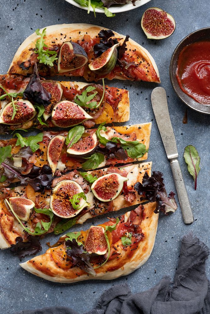 Pizza mozzarella fig and lettuce slices food photography flat lay