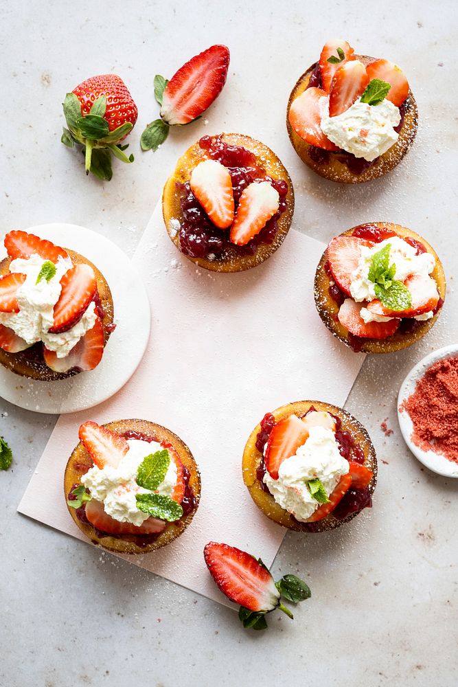 Strawberry cupcake on blank card flat lay