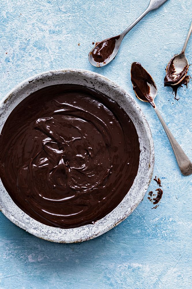 Chocolate ganache being stirred in a bowl food photography