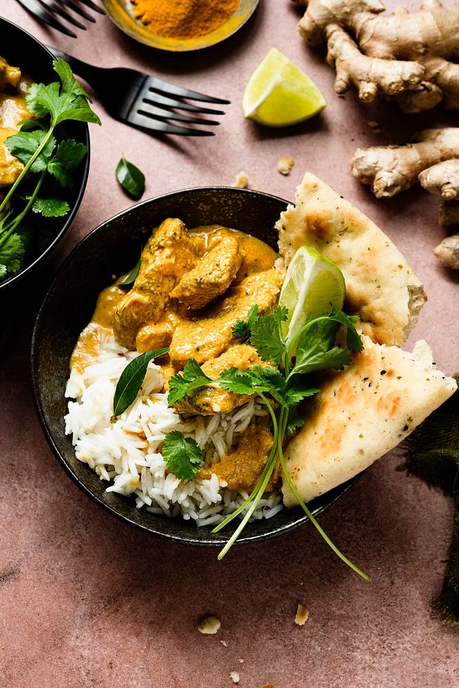 Butter chicken Indian curry with rice in a plate food photography