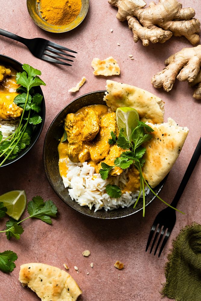 Butter chicken Indian curry with rice in a plate food photography
