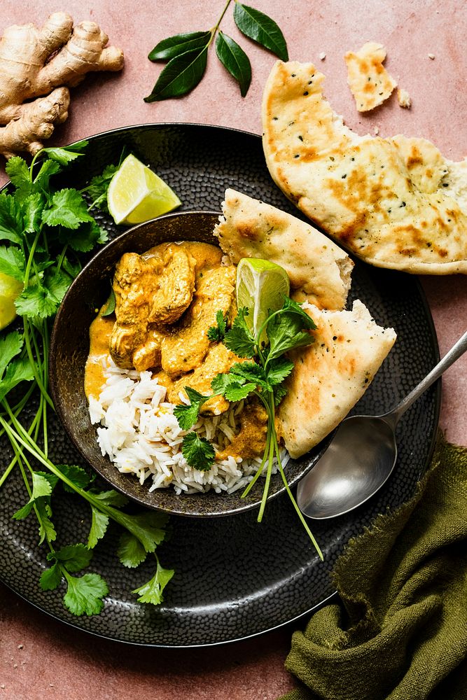 Butter chicken Indian curry with rice in a pan food photography