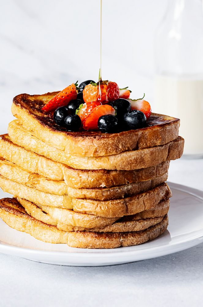 Stacked french toast with mixed berries, breakfast food photography