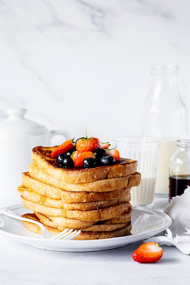 Stacked french toast with mixed berries, breakfast food photography