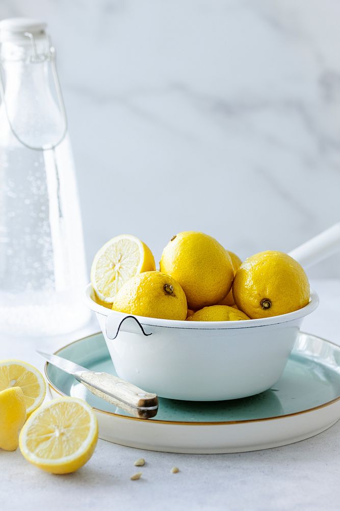 Lemons placed in a bowl food photography