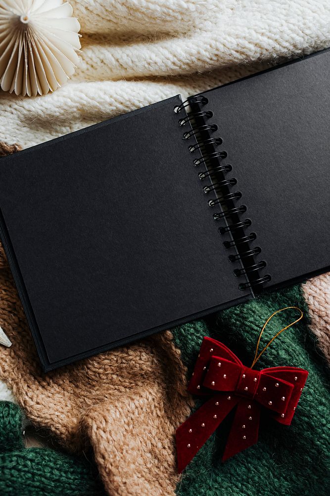 Black personal planner on a sweater