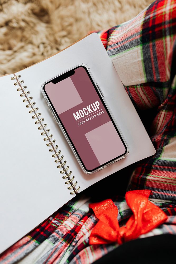 Smartphone mockup screen on a notebook template