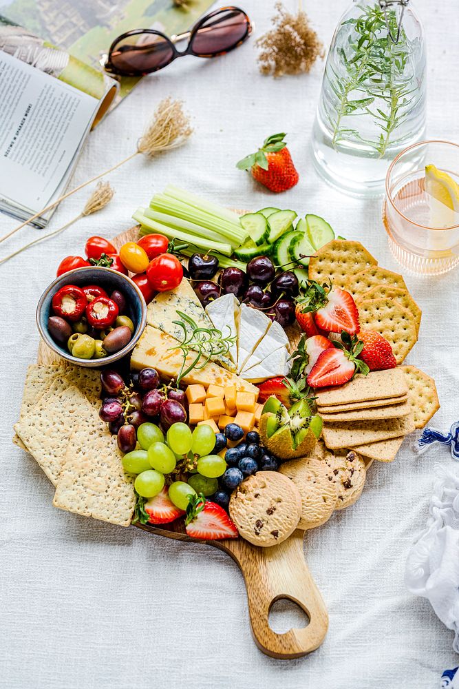 Cheese board with fresh fruits and crackers