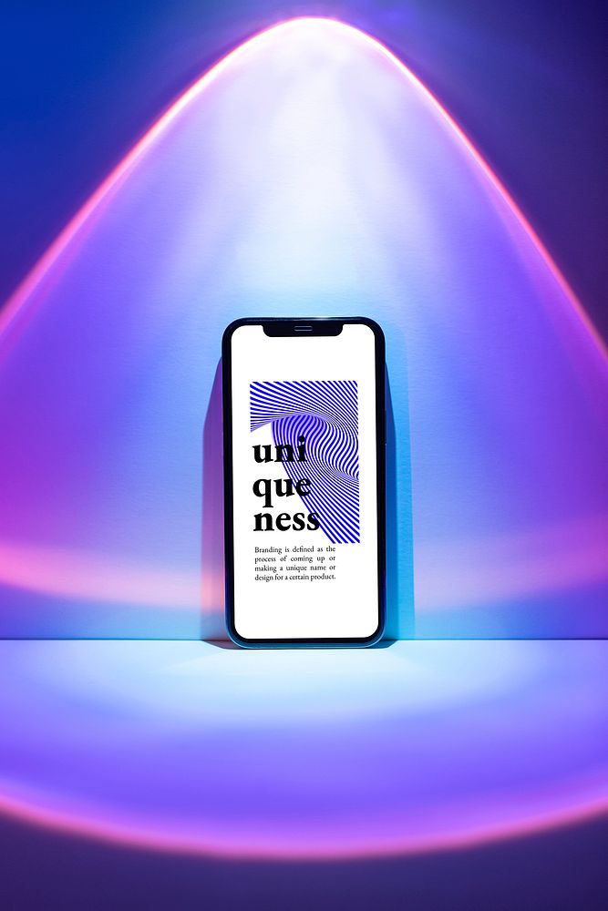 Mobile phone psd mockup with purple sunset projector lamp