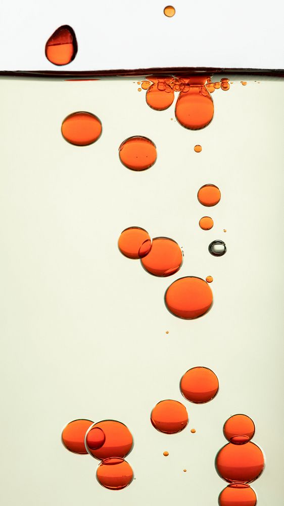 Phone wallpaper abstract orange oil bubble background