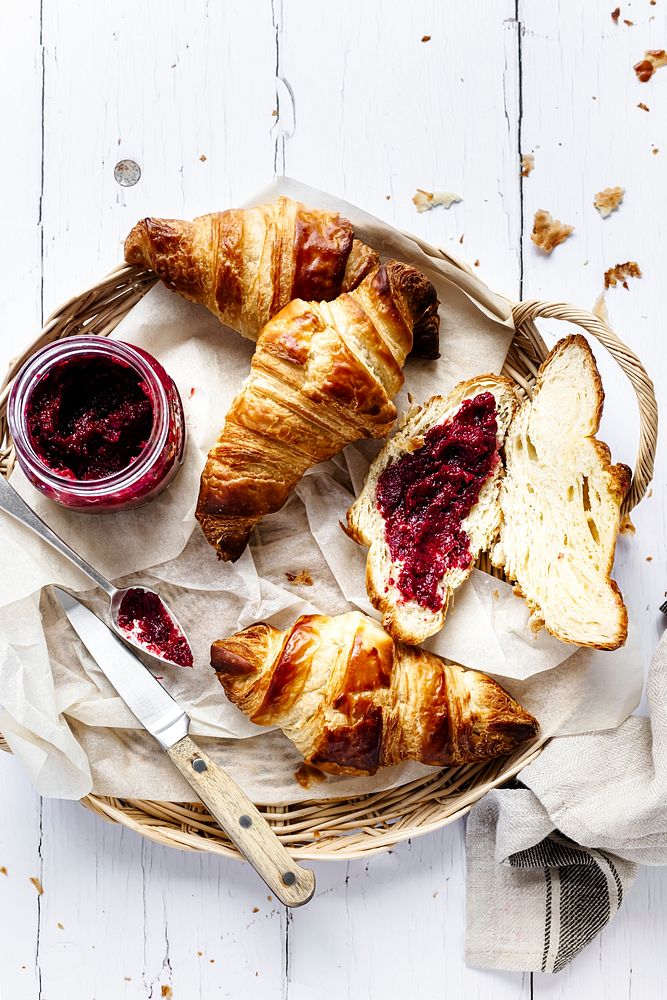 Breakfast set flat lay with croissant and raspberry jam food photography