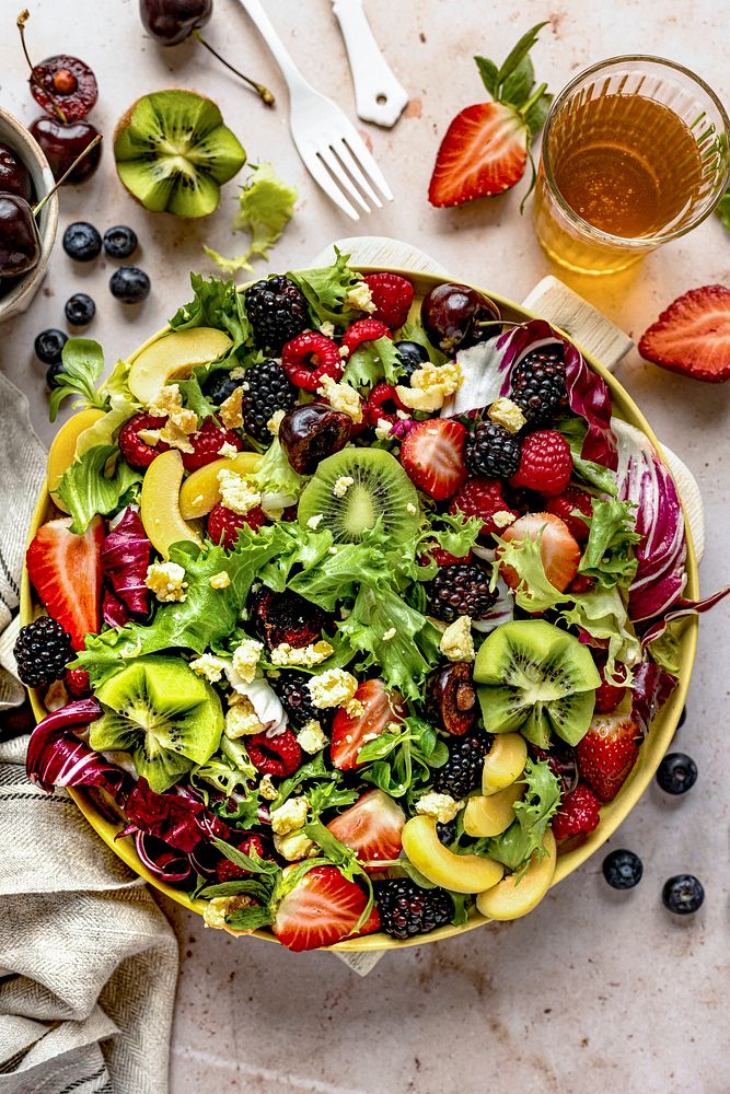 Healthy salad bowl with veggies and berries