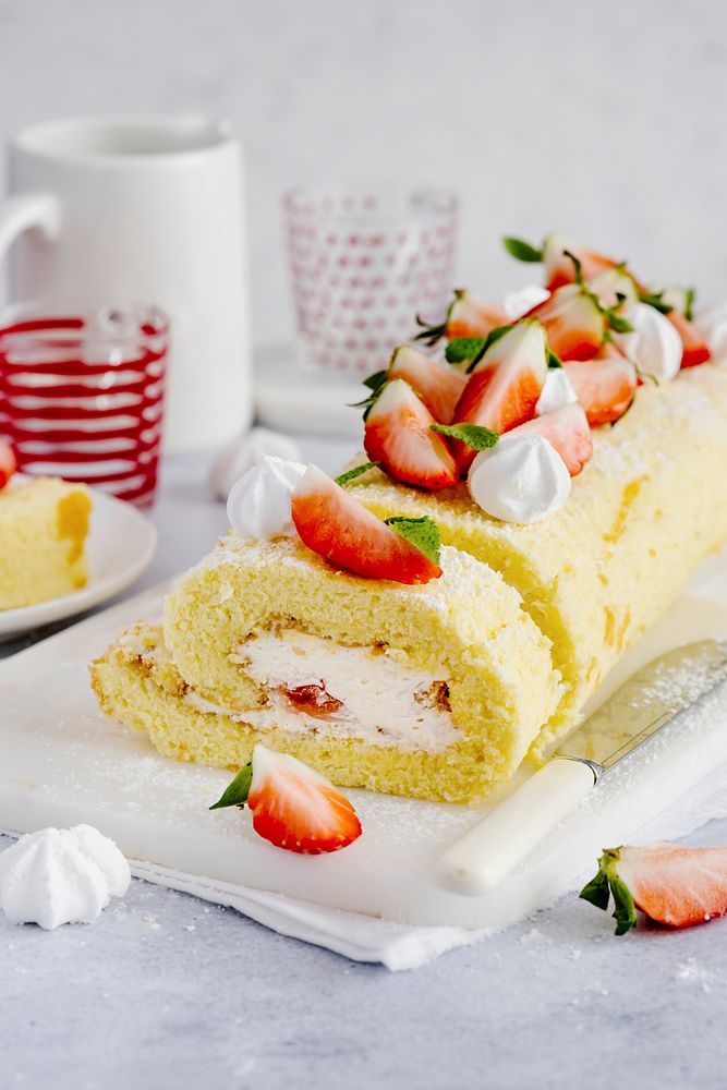 Dessert and tea with strawberry Swiss roll food photography