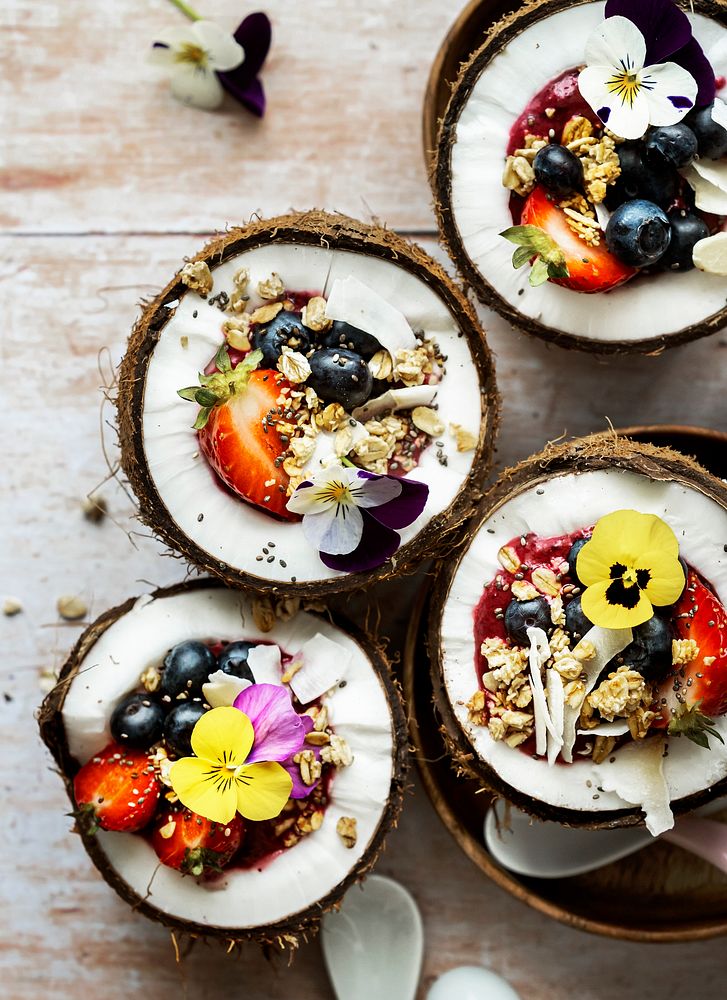 Flat lay fruits and grains in coconut shell tropical vibes 