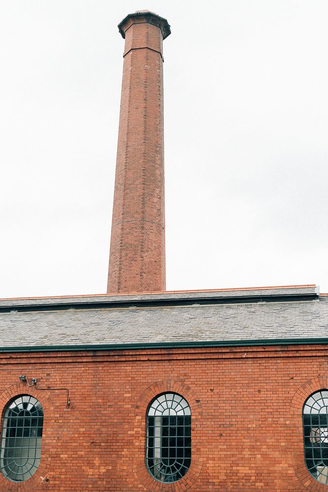Tall chimney of a brick building