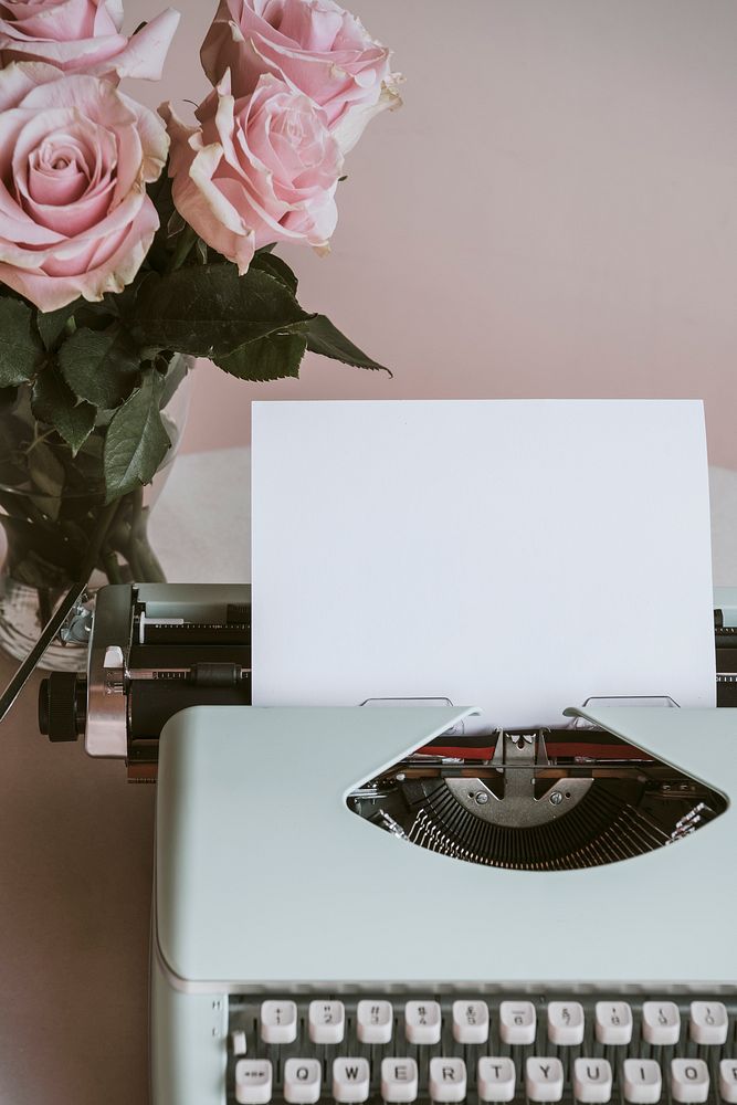 Retro mint typewriter by pink roses