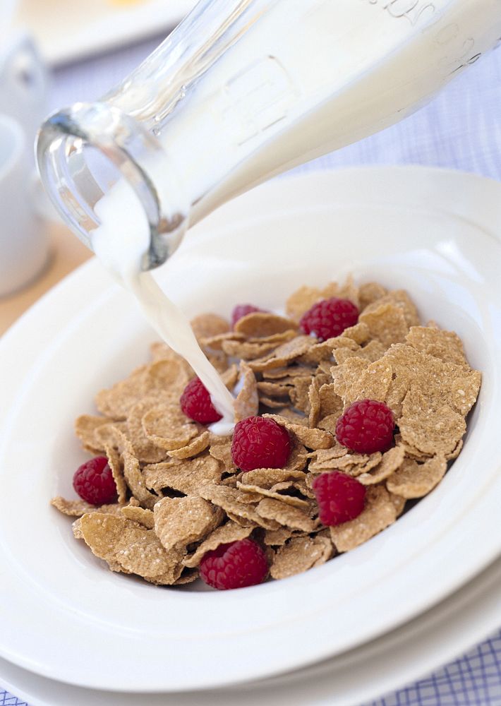 Free cornflakes with berry, milk photo, public domain food CC0 image.