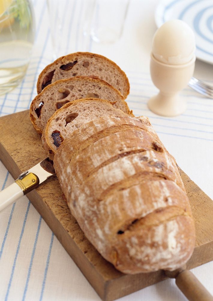 Free close up slice fresh bread on cutting board image, public domain food CC0 photo.