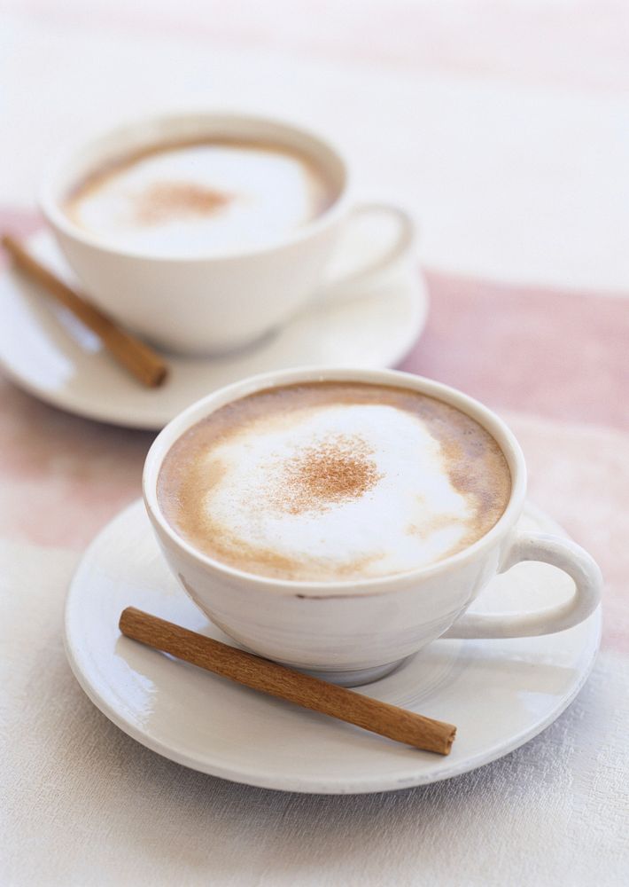 Free cappuccino cups with cinnamon stick photo, public domain beverage CC0 image.