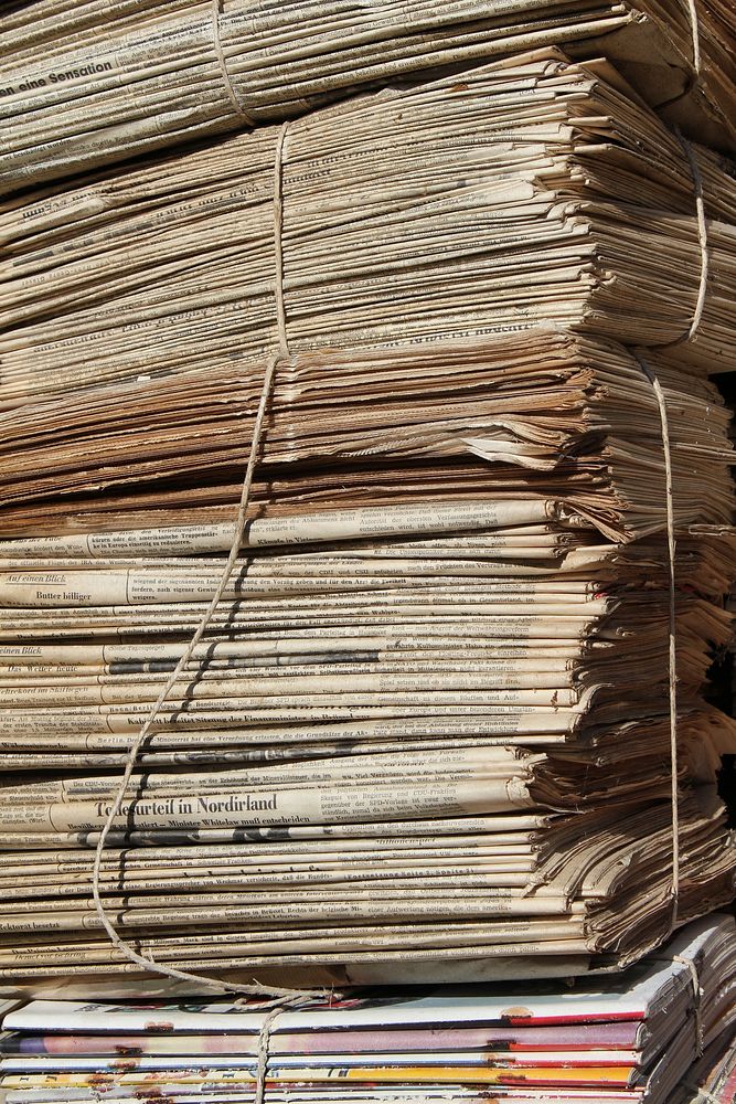 Old stacked newpapers, free public domain CC0 image.