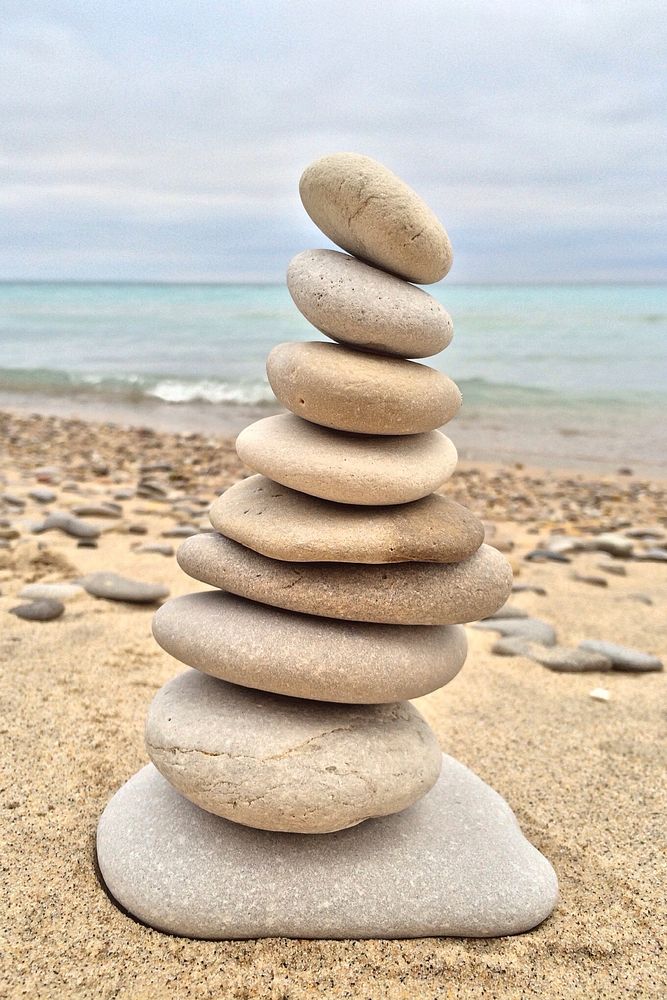 Beach pebble stones stacking photo, free public domain CC0 photo.