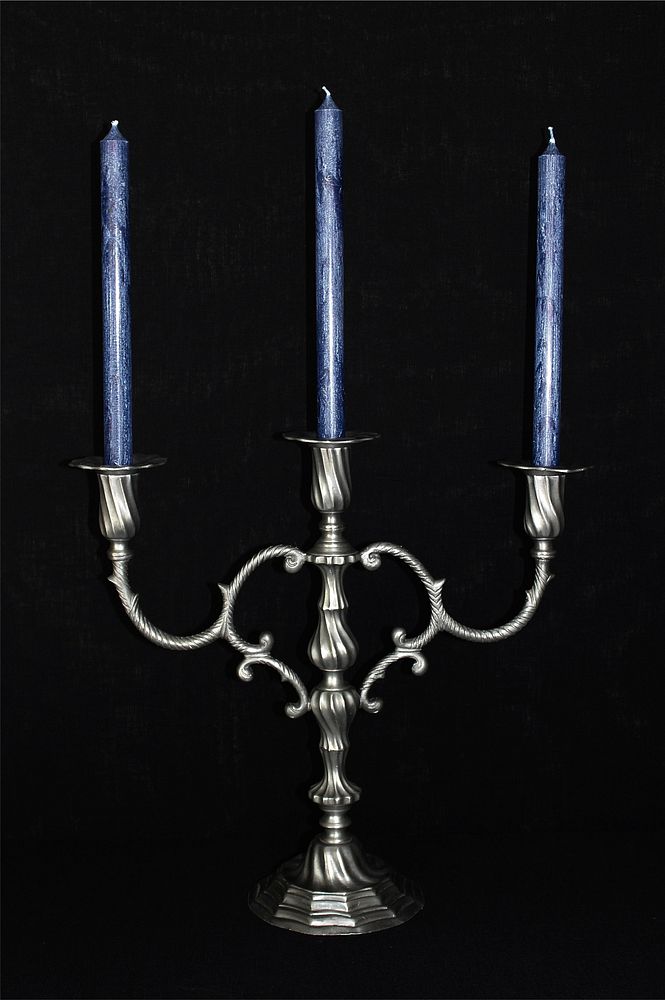 Free antique candle holder on black background image, public domain CC0 photo.
